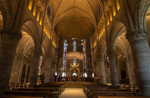 Presbytery with stained glass windows and Virgen de Roncesvalles